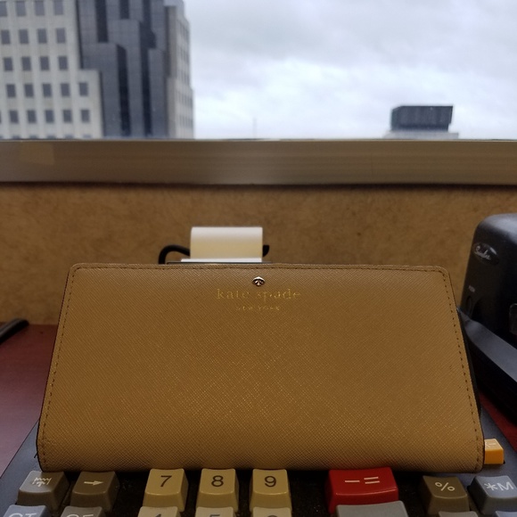 kate spade Handbags - Kate Spade slim taupe bifold wallet FINAL PRICE